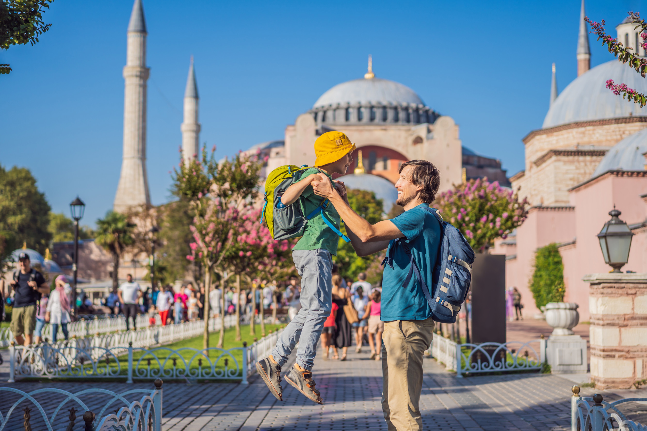 father and son tourists enjoy beautiful view on hagia sophia cathedral famous islamic