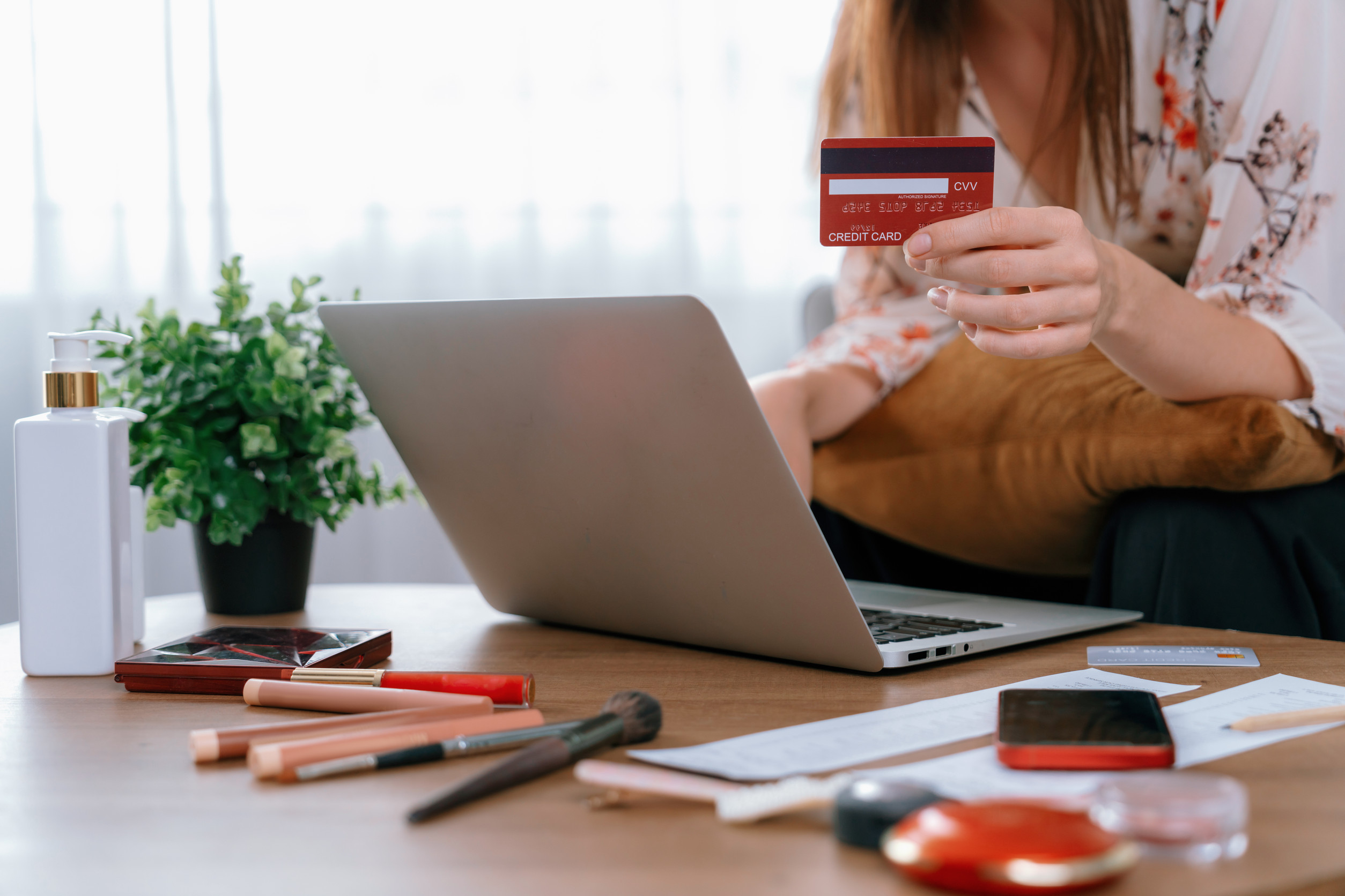 young happy woman buy product by online shopping at home while ordering items from the internet